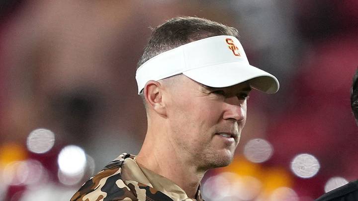 Sep 12, 2026; Los Angeles, California, USA; Southern California Trojans head coach Lincoln Riley (left) talks with Louisiana Ragin' Cajuns head coach Michael Desormeaux before the game at United Airlines Field at Los Angeles Memorial Coliseum. Mandatory Credit: Kirby Lee-Imagn Images Sep 12, 2026; Los Angeles, California, USA; Southern California Trojans head coach Lincoln Riley (left) talks with Louisiana Ragin' Cajuns head coach Michael Desormeaux before the game at United Airlines Field at Los Angeles Memorial Coliseum. Mandatory Credit: Kirby Lee-Imagn Images