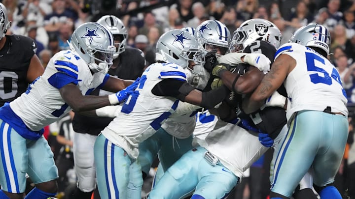 Dallas Cowboys defenders Donovan Ezeiruaku and Sam Williams tackle Las Vegas Raiders running back Ashton Jeanty for a safety Dallas Cowboys defenders Donovan Ezeiruaku and Sam Williams tackle Las Vegas Raiders running back Ashton Jeanty for a safety