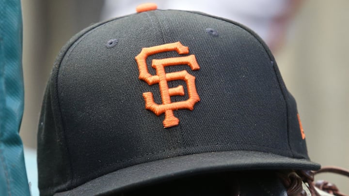 Jul 14, 2023; Pittsburgh, Pennsylvania, USA;  San Francisco Giants hat and glove on the bench against the Pittsburgh Pirates during the first inning at PNC Park. 