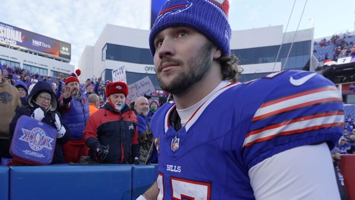 Buffalo Bills quarterback Josh Allen briefly interacts with fans before leaving the field.