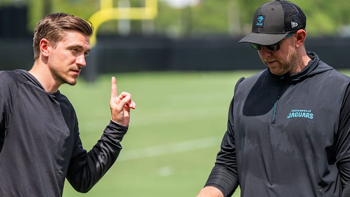 Jacksonville Jaguars general manager James Gladstone, left, talks with Jacksonville Jaguars head coach Liam Coen, right, after the. Jacksonville Jaguars’ mandatory minicamp Tuesday June 10, 2025 at the Miller Electric Center in Jacksonville, Fla. [Doug Engle/Florida Times-Union]