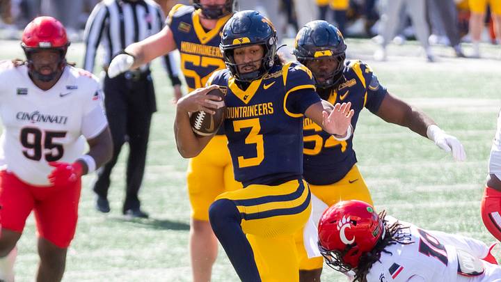 Oct 17, 2026; Morgantown, West Virginia, USA; West Virginia Mountaineers quarterback Michael Hawkins Jr. (3) runs the ball for a touchdown during the second quarter against the Cincinnati Bearcats at Milan Puskar Stadium. Mandatory Credit: Ben Queen-Imagn Images Oct 17, 2026; Morgantown, West Virginia, USA; West Virginia Mountaineers quarterback Michael Hawkins Jr. (3) runs the ball for a touchdown during the second quarter against the Cincinnati Bearcats at Milan Puskar Stadium. Mandatory Credit: Ben Queen-Imagn Images