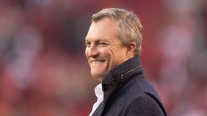 Dec 19, 2021; Santa Clara, California, USA;  San Francisco 49ers general manager John Lynch smiles after defeating the Atlanta Falcons at Levi's Stadium. Mandatory Credit: Stan Szeto-Imagn Images