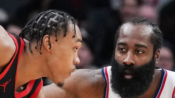 Toronto Raptors forward Scottie Barnes controls the ball as LA Clippers guard James Harden tries to defend.
