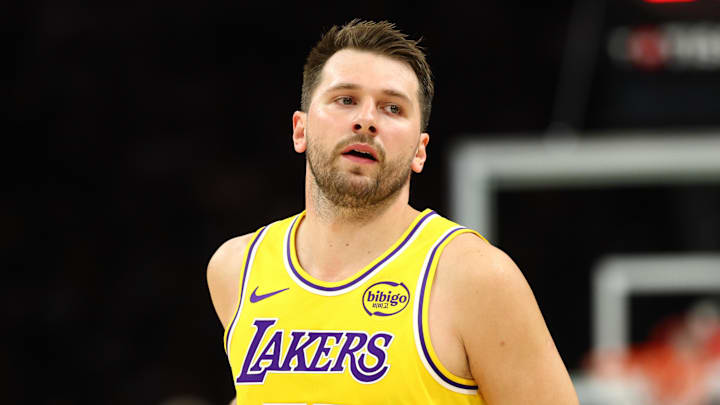 Feb 26, 2026; Phoenix, Arizona, USA; Los Angeles Lakers guard Luka Doncic (77) against the Phoenix Suns in the first half at Mortgage Matchup Center. Mandatory Credit: Mark J. Rebilas-Imagn Images