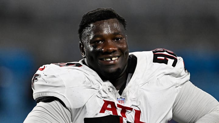 Oct 13, 2024; Charlotte, North Carolina, USA; Atlanta Falcons defensive tackle Ruke Orhorhoro (98) walks off the field after the game at Bank of America Stadium. 