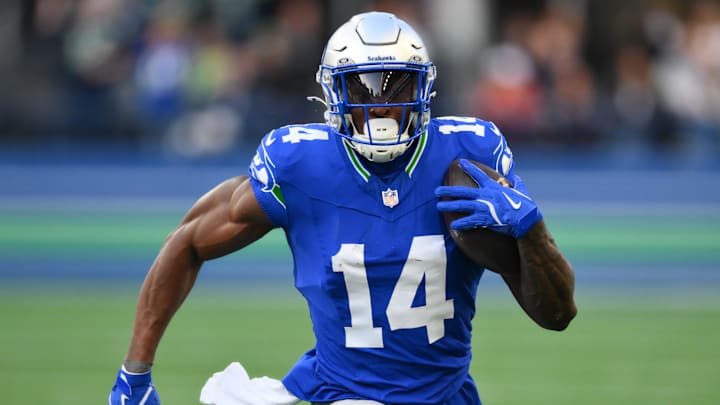 Oct 10, 2024; Seattle, Washington, USA; Seattle Seahawks wide receiver DK Metcalf (14) carries the ball after a catch during the first half against the San Francisco 49ers at Lumen Field. Mandatory Credit: Steven Bisig-Imagn Images Oct 10, 2024; Seattle, Washington, USA; Seattle Seahawks wide receiver DK Metcalf (14) carries the ball after a catch during the first half against the San Francisco 49ers at Lumen Field. Mandatory Credit: Steven Bisig-Imagn Images
