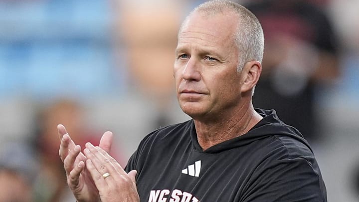Sep 7, 2024; Charlotte, North Carolina, USA; North Carolina State Wolfpack head coach Dave Doeren during pregame activities against the Tennessee Volunteers at the Dukes Mayo Classic at Bank of America Stadium. Mandatory Credit: Jim Dedmon-Imagn Images Sep 7, 2024; Charlotte, North Carolina, USA; North Carolina State Wolfpack head coach Dave Doeren during pregame activities against the Tennessee Volunteers at the Dukes Mayo Classic at Bank of America Stadium. Mandatory Credit: Jim Dedmon-Imagn Images