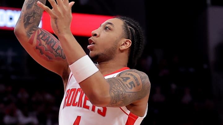 Feb 5, 2026; Houston, Texas, USA; Houston Rockets guard JD Davison (4) shoots inside against the Charlotte Hornets during the fourth quarter at Toyota Center. Mandatory Credit: Erik Williams-Imagn Images