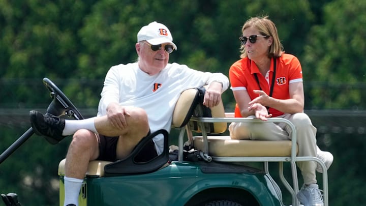 Cincinnati Bengals executives Mike Brown and his daughter Katie Blackburn talk on the sideline during a session of organized team activities on the Bengals practice field at Paycor Stadium in downtown Cincinnati on Tuesday, June 3, 2025.
