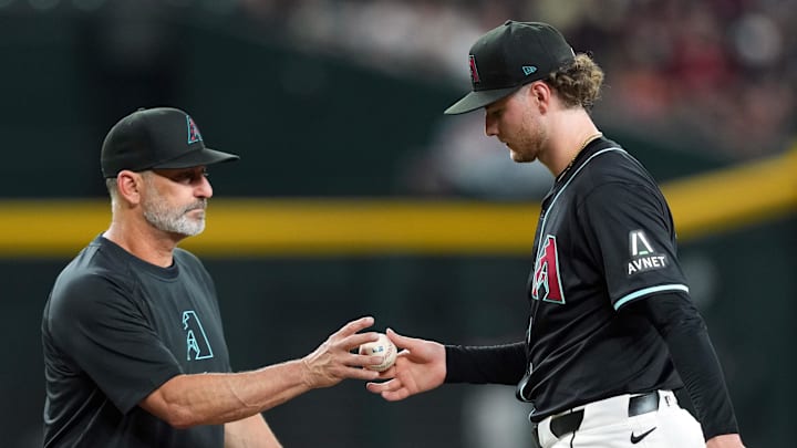 Jun 26, 2024; Phoenix, Arizona, USA; Arizona Diamondbacks manager Torey Lovullo (17) removes Arizona Diamondbacks pitcher Ryne Nelson (19) from the game against the Minnesota Twins during the fourth inning at Chase Field. Mandatory Credit: Joe Camporeale-Imagn Images