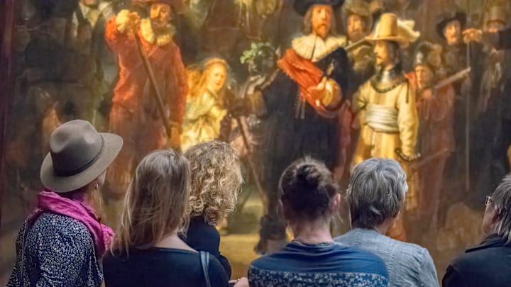 Crowds gather around Rembrandt’s The Night Watch.