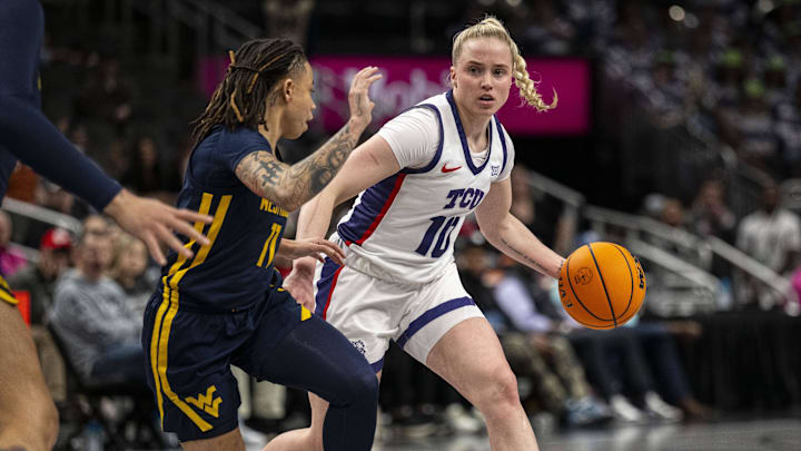Mar 8, 2025; Kansas City, MO, USA; TCU Horned Frogs guard Hailey Van Lith (10) handles the ball while while defended by  West Virginia Mountaineers guard JJ Quinerly (11) during the first half at T-Mobile Center.