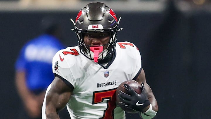 Oct 3, 2024; Atlanta, Georgia, USA; Tampa Bay Buccaneers running back Bucky Irving (7) runs the ball against the Atlanta Falcons in the first quarter at Mercedes-Benz Stadium. Mandatory Credit: Brett Davis-Imagn Images