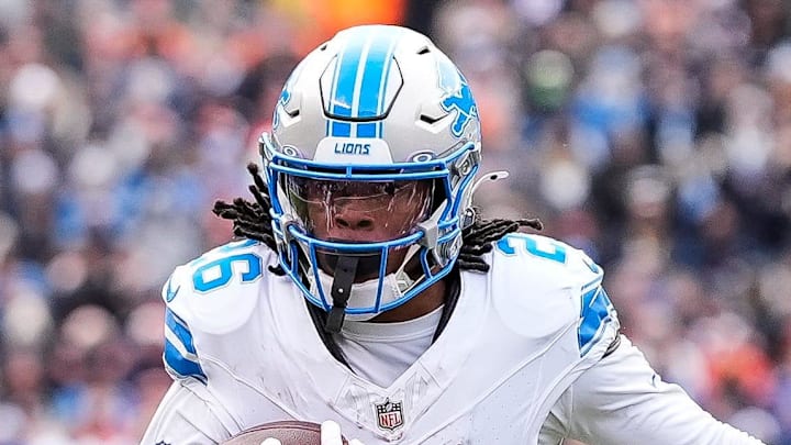 Detroit Lions running back Jahmyr Gibbs (26) runs against Chicago Bears linebacker Tremaine Edmunds (49) during the first half at Soldier Field in Chicago, Ill. on Sunday, Dec. 22, 2024.