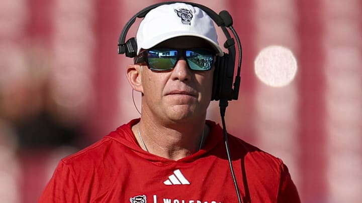 Dec 19, 2025; Tampa, FL, USA; NC State Wolfpack head coach Dave Doeren looks on against the Memphis Tigers in the first quarter during the Gasparilla Bowl at Raymond James Stadium. Mandatory Credit: Nathan Ray Seebeck-Imagn Images Dec 19, 2025; Tampa, FL, USA; NC State Wolfpack head coach Dave Doeren looks on against the Memphis Tigers in the first quarter during the Gasparilla Bowl at Raymond James Stadium. Mandatory Credit: Nathan Ray Seebeck-Imagn Images