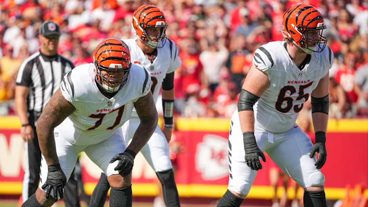 Sep 15, 2024; Kansas City, Missouri, USA; Cincinnati Bengals offensive tackle Trent Brown (77) and guard Alex Cappa (65) on the line of scrimmage against the Kansas City Chiefs during the game at GEHA Field at Arrowhead Stadium. Mandatory Credit: Denny Medley-Imagn Images