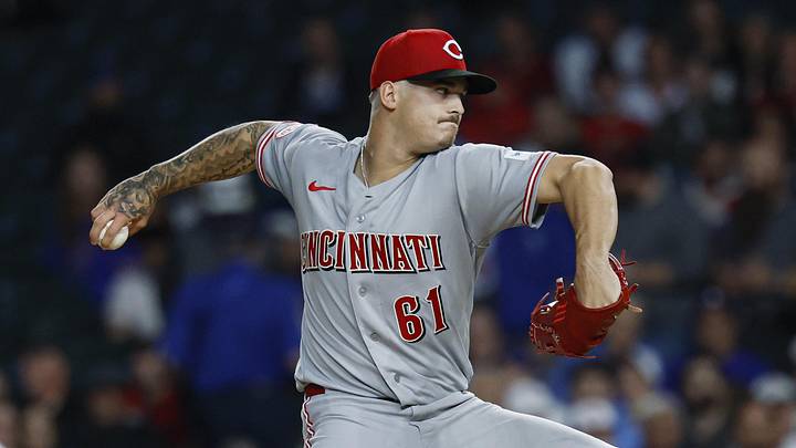 Cincinnati Reds starting pitcher Chase Petty (61) delivers a pitch