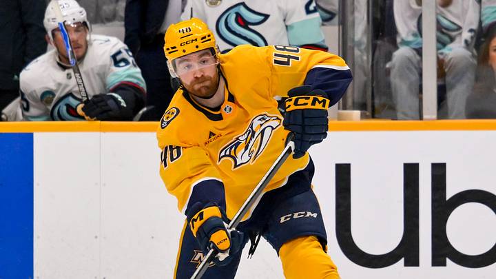 Mar 19, 2026; Nashville, Tennessee, USA;  Nashville Predators defenseman Nick Perbix (48) passes the puck against the Seattle Kraken during the first period at Bridgestone Arena. Mandatory Credit: Steve Roberts-Imagn Images
