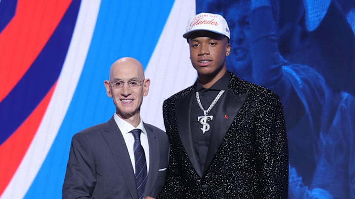 Jun 25, 2025; Brooklyn, NY, USA; Thomas Sorber stands with NBA commissioner Adam Silver after being selected as the 15th pick by the Oklahoma City Thunder in the first round of the 2025 NBA Draft at Barclays Center. Mandatory Credit: Brad Penner-Imagn Images Jun 25, 2025; Brooklyn, NY, USA; Thomas Sorber stands with NBA commissioner Adam Silver after being selected as the 15th pick by the Oklahoma City Thunder in the first round of the 2025 NBA Draft at Barclays Center. Mandatory Credit: Brad Penner-Imagn Images