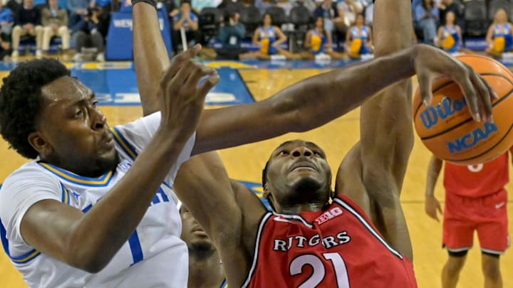 Feb 3, 2026; Los Angeles, California, USA;  Rutgers Scarlet Knights guard Darren Buchanan Jr. (5) shoots over UCLA Bruins forward Xavier Booker (1) in the second half at Pauley Pavilion presented by Wescom Financial. Mandatory Credit: Jayne Kamin-Oncea-Imagn Images