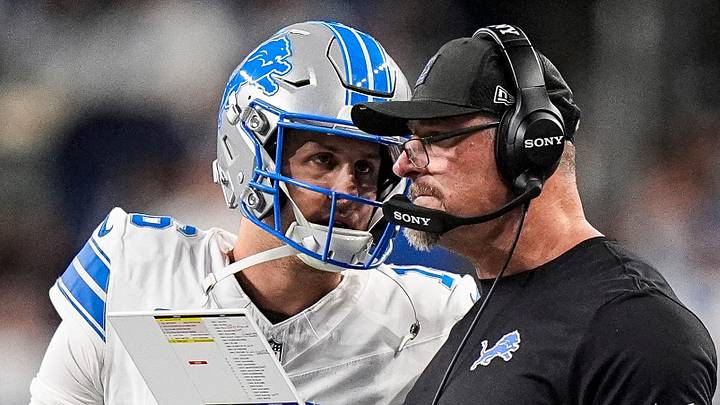 Detroit Lions quarterback Jared Goff (16) talks to head coach Dan Campbell before a play against Dallas Cowboys Detroit Lions quarterback Jared Goff (16) talks to head coach Dan Campbell before a play against Dallas Cowboys