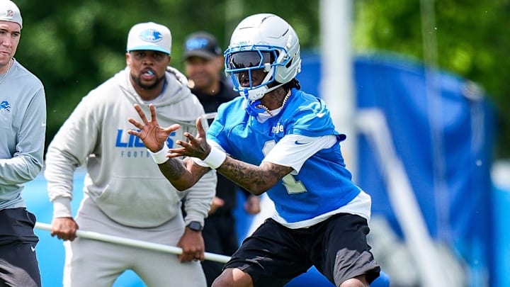 Detroit Lions wide receiver Jameson Williams makes a a catch at practice during OTAs Detroit Lions wide receiver Jameson Williams makes a a catch at practice during OTAs