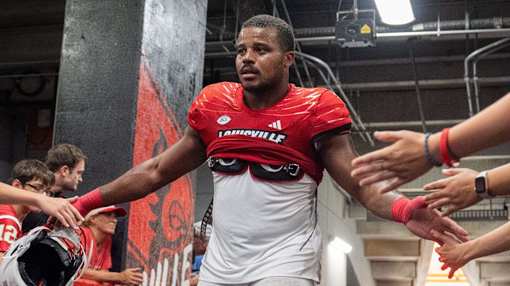Louisville Cardinals tight end Duane Martin (45) high fives fans as he heads back into the locker room after their game against the Austin Peay Governors on Saturday, Aug. 31, 2024 at L&N Federal Credit Union Stadium in Louisville, Ky. The Louisville Cardinals beat the Austin Peay Governors 62-0. Louisville Cardinals tight end Duane Martin (45) high fives fans as he heads back into the locker room after their game against the Austin Peay Governors on Saturday, Aug. 31, 2024 at L&N Federal Credit Union Stadium in Louisville, Ky. The Louisville Cardinals beat the Austin Peay Governors 62-0.