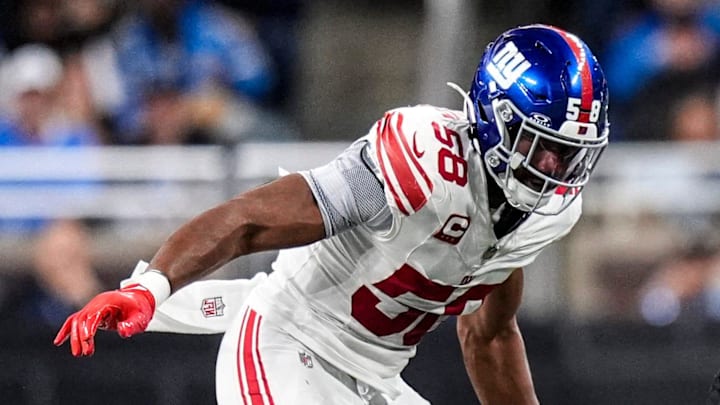 Detroit Lions wide receiver Amon-Ra St. Brown (14) makes a catch against New York Giants cornerback Dru Phillips (22) and linebacker Bobby Okereke (58) during the second half at Ford Field in Detroit on Sunday, Nov. 23, 2025.