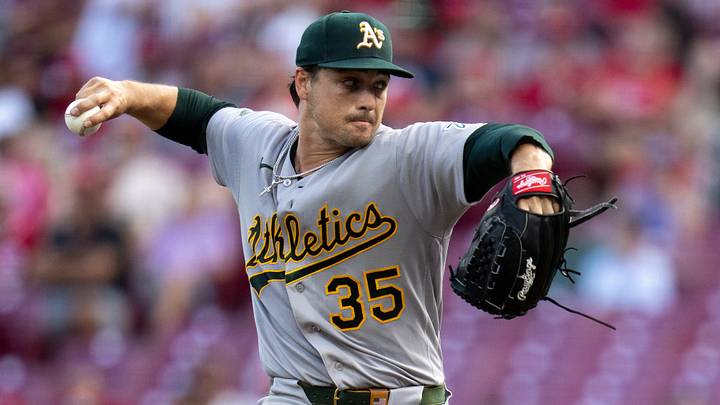 Athletics starting pitcher J.T. Ginn (35) delivers a pitch in the first inning between the Athletics and Cincinnati Reds at Great American Ball Park in Cincinnati on Tuesday, August 4, 2026. Athletics starting pitcher J.T. Ginn (35) delivers a pitch in the first inning between the Athletics and Cincinnati Reds at Great American Ball Park in Cincinnati on Tuesday, August 4, 2026.