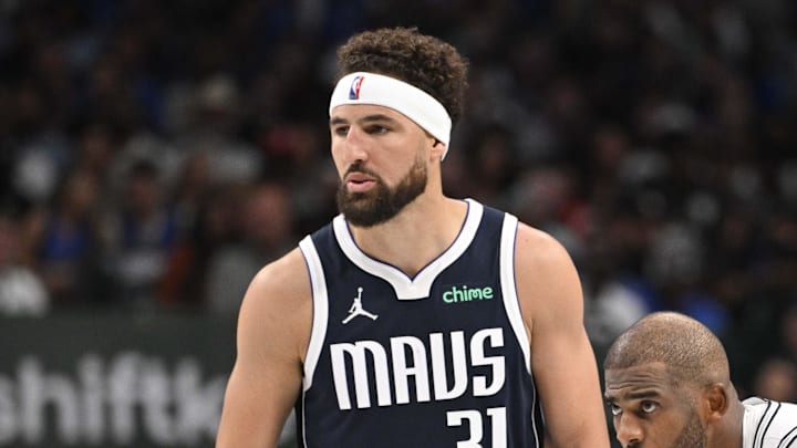 Oct 24, 2024; Dallas, Texas, USA; Dallas Mavericks guard Klay Thompson (31) and San Antonio Spurs guard Chris Paul (3) look on during the second half at the American Airlines Center. Mandatory Credit: Jerome Miron-Imagn Images