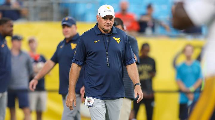 Sep 19, 2026; Charlotte, North Carolina, USA; West Virginia Mountaineers head coach Rich Rodriguez walks on the field before their game against the Virginia Cavaliers at Bank of America Stadium. Mandatory Credit: Ben Queen-Imagn Images Sep 19, 2026; Charlotte, North Carolina, USA; West Virginia Mountaineers head coach Rich Rodriguez walks on the field before their game against the Virginia Cavaliers at Bank of America Stadium. Mandatory Credit: Ben Queen-Imagn Images