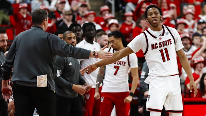 Feb 7, 2026; Raleigh, North Carolina, USA; NC State Wolfpack guard Quadir Copeland (11) and head coach Will Wade react during the second half of the game against the Virginia Tech Hokies at Lenovo Center. Mandatory Credit: Jaylynn Nash-Imagn Images Feb 7, 2026; Raleigh, North Carolina, USA; NC State Wolfpack guard Quadir Copeland (11) and head coach Will Wade react during the second half of the game against the Virginia Tech Hokies at Lenovo Center. Mandatory Credit: Jaylynn Nash-Imagn Images