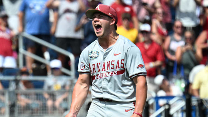 Jun 16, 2025; Omaha, Neb, USA; Arkansas Razorbacks starting pitcher Gage Wood (14) celebrates completing a no hitter against the Murray State Racers at Charles Schwab Field. Mandatory Credit: Steven Branscombe-Imagn Images