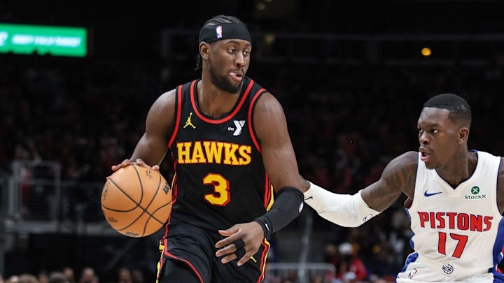 Feb 23, 2025; Atlanta, Georgia, USA; Atlanta Hawks guard Caris LeVert (3) dribbles the ball down the court against Detroit Pistons guard Dennis Schroder (17) during the third quarter at State Farm Arena. Mandatory Credit: Jordan Godfree-Imagn Images