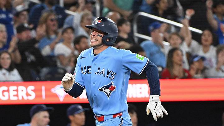Jun 14, 2026; Toronto, Ontario, CAN; Toronto Blue Jays short stop Ernie Clement (22) scores in the fourth inning against the New York Yankees at Rogers Centre. Mandatory Credit: Gerry Angus-Imagn Images