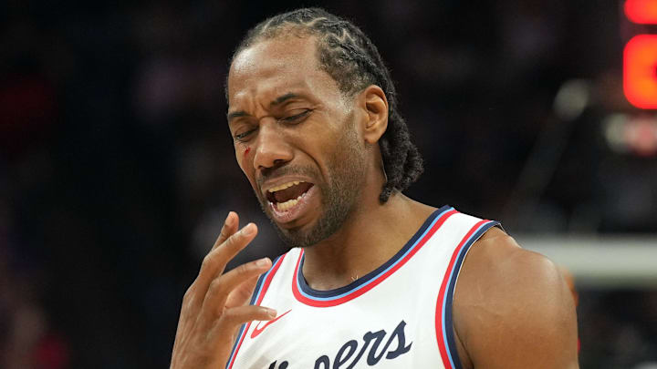Apr 11, 2025; Sacramento, California, USA; Los Angeles Clippers forward Kawhi Leonard (2) reacts after incurring a facial cut during the fourth quarter against the Sacramento Kings at Golden 1 Center. Mandatory Credit: Darren Yamashita-Imagn Images