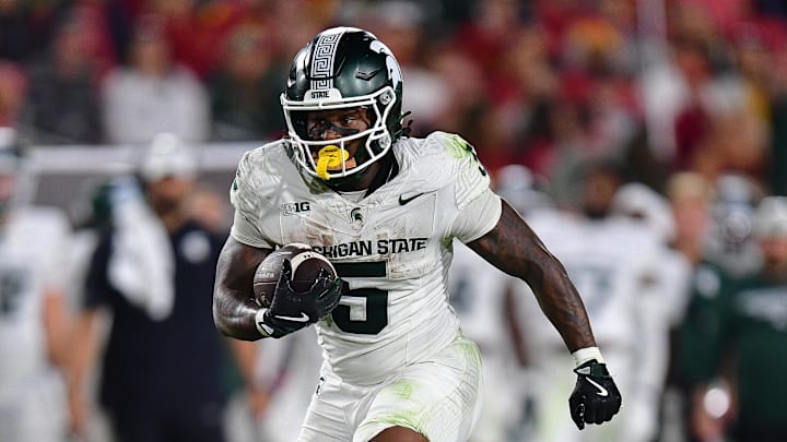 Sep 20, 2025; Los Angeles, California, USA; Michigan State Spartans running back Makhi Frazier (5) runs the ball against the Southern California Trojans during the second half at the Los Angeles Memorial Coliseum.