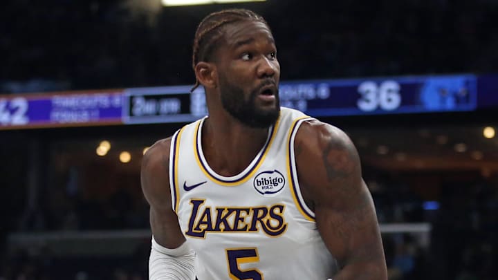 Oct 31, 2025; Memphis, Tennessee, USA; Los Angeles Lakers center Deandre Ayton (5) spins to the basket as Memphis Grizzlies forward Vince Williams Jr. (5) defends during the second quarter at FedExForum. Mandatory Credit: Petre Thomas-Imagn Images