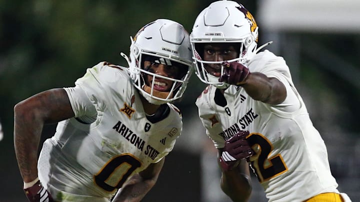 Sep 6, 2025; Starkville, Mississippi, USA; Arizona State Sun Devils wide receiver Jordyn Tyson (0) and wide receiver Malik McClain (12) react after a catch during the fourth quarter against the Mississippi State Bulldogs at Davis Wade Stadium at Scott Field. Mandatory Credit: Petre Thomas-Imagn Images