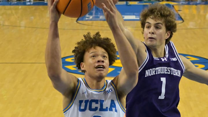 Jan 24, 2026; Los Angeles, California, USA; UCLA Bruins guard Trent Perry (0) drives past Northwestern Wildcats forward Tyler Kropp (1) for a basket in the first half at Pauley Pavilion presented by Wescom Financial. Mandatory Credit: Jayne Kamin-Oncea-Imagn Images Jan 24, 2026; Los Angeles, California, USA; UCLA Bruins guard Trent Perry (0) drives past Northwestern Wildcats forward Tyler Kropp (1) for a basket in the first half at Pauley Pavilion presented by Wescom Financial. Mandatory Credit: Jayne Kamin-Oncea-Imagn Images