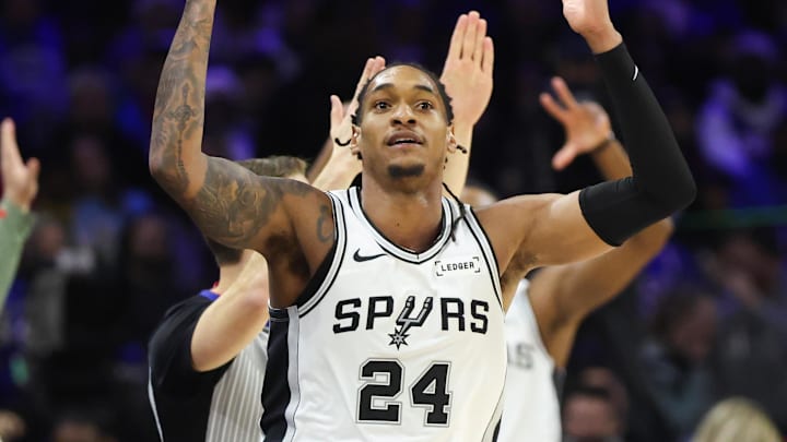 Mar 3, 2026; Philadelphia, Pennsylvania, USA; San Antonio Spurs guard Devin Vassell (24) reacts to his three pointer against the Philadelphia 76ers during the third quarter at Xfinity Mobile Arena. Mandatory Credit: Bill Streicher-Imagn Images