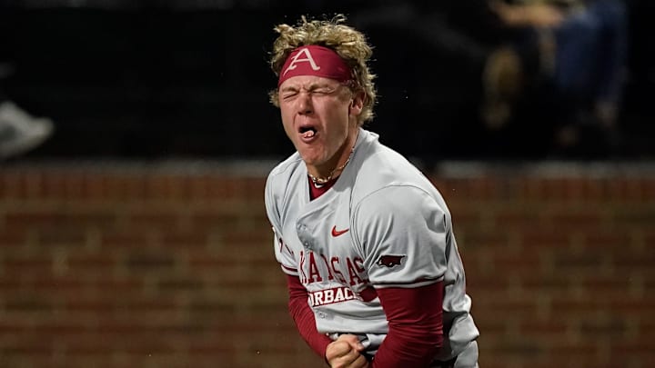 Arkansas left fielder Charles Davalan (24) reacts after he safely reached home against Vanderbilt on a double hit by Kuhio Aloy during the ninth inning at Hawkins Field in Nashville, Tenn., Friday, March 28, 2025.