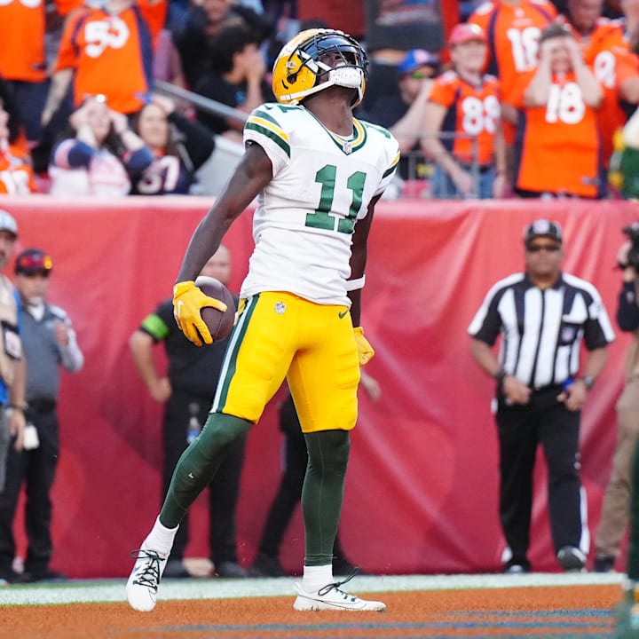 Green Bay Packers receiver Jayden Reed celebrates a touchdown reception in the second half against the Broncos in 2023.