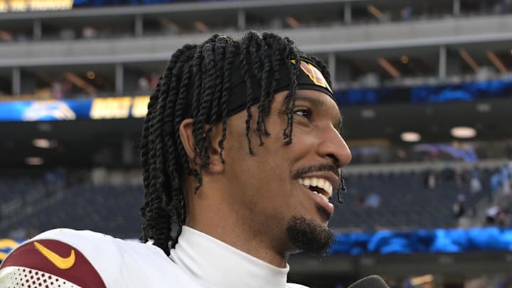 Oct 5, 2025; Inglewood, California, USA; FOX sideline reporter Erin Andrews interviews Washington Commanders quarterback Jayden Daniels (5) after the game against the Los Angeles Chargers at SoFi Stadium. Mandatory Credit: Jayne Kamin-Oncea-Imagn Images
