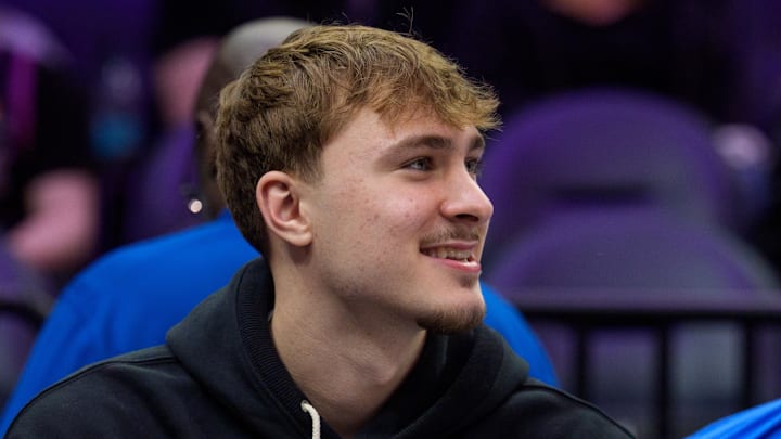 Feb 20, 2026; Minneapolis, Minnesota, USA; Dallas Mavericks forward Cooper Flagg (32) watches the second quarter against the Minnesota Timberwolves at Target Center. Mandatory Credit: Matt Blewett-Imagn Images