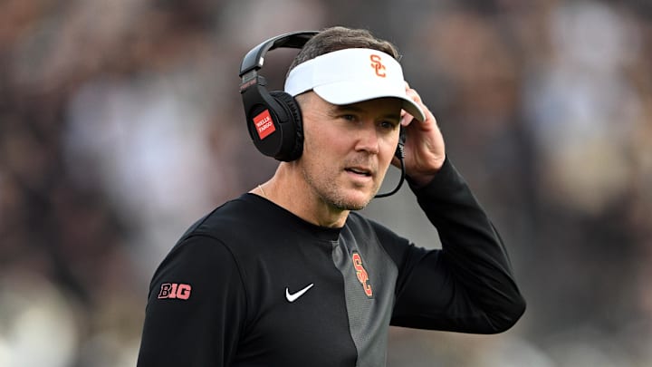 Sep 13, 2025; West Lafayette, Indiana, USA; Southern California Trojans head coach Lincoln Riley stands on the sidelines during the first quarter against the Purdue Boilermakers at Ross-Ade Stadium. Mandatory Credit: Marc Lebryk-Imagn Images Sep 13, 2025; West Lafayette, Indiana, USA; Southern California Trojans head coach Lincoln Riley stands on the sidelines during the first quarter against the Purdue Boilermakers at Ross-Ade Stadium. Mandatory Credit: Marc Lebryk-Imagn Images