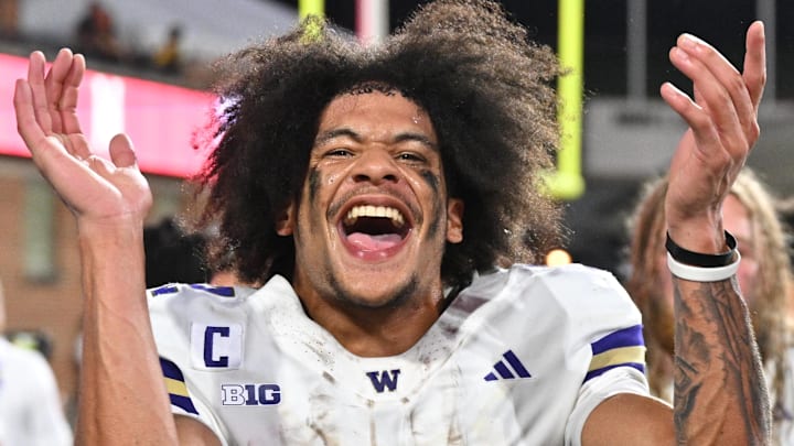 Oct 4, 2025; College Park, Maryland, USA;  Washington Huskies wide receiver Denzel Boston (12) celebrates after the Huskies comeback victory over the Maryland Terrapins at SECU Stadium. Mandatory Credit: Jamie Sabau-Imagn Images