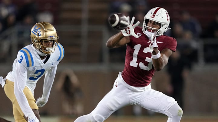Oct 21, 2023; Stanford, California, USA; Stanford Cardinal wide receiver Elic Ayomanor (13) catches a pass against UCLA Bruins defensive back Devin Kirkwood (3) during the fourth quarter at Stanford Stadium. 