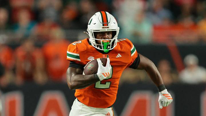 Oct 17, 2025; Miami Gardens, Florida, USA; Miami Hurricanes running back Jordan Lyle (2) carries the football against the Louisville Cardinals during the fourth quarter at Hard Rock Stadium. Mandatory Credit: Sam Navarro-Imagn Images